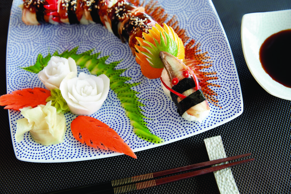 Colorful sushi platter with garnishes